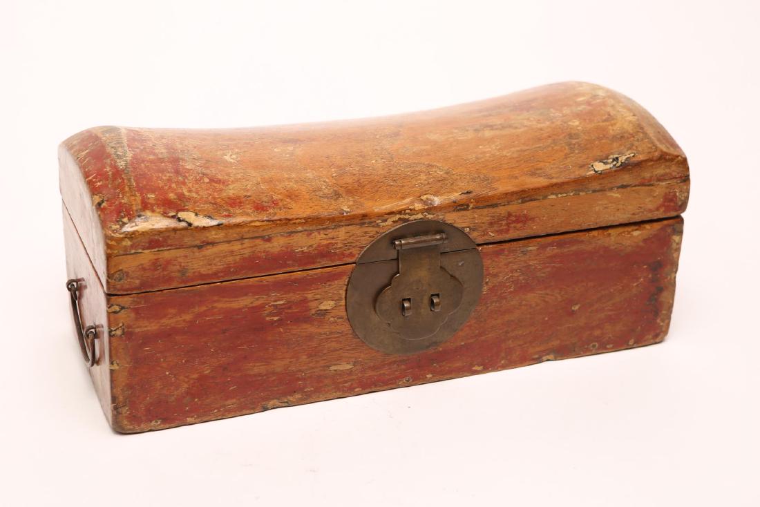 Chinese Qing Dynasty Wood Pillow Valuables Box: Chinese Qing Dynasty red-painted wood pillow and valuables box combination, with hinged cover, circular lock plate, and wire bale handles, the interior with a removable tray above a larger well. Some