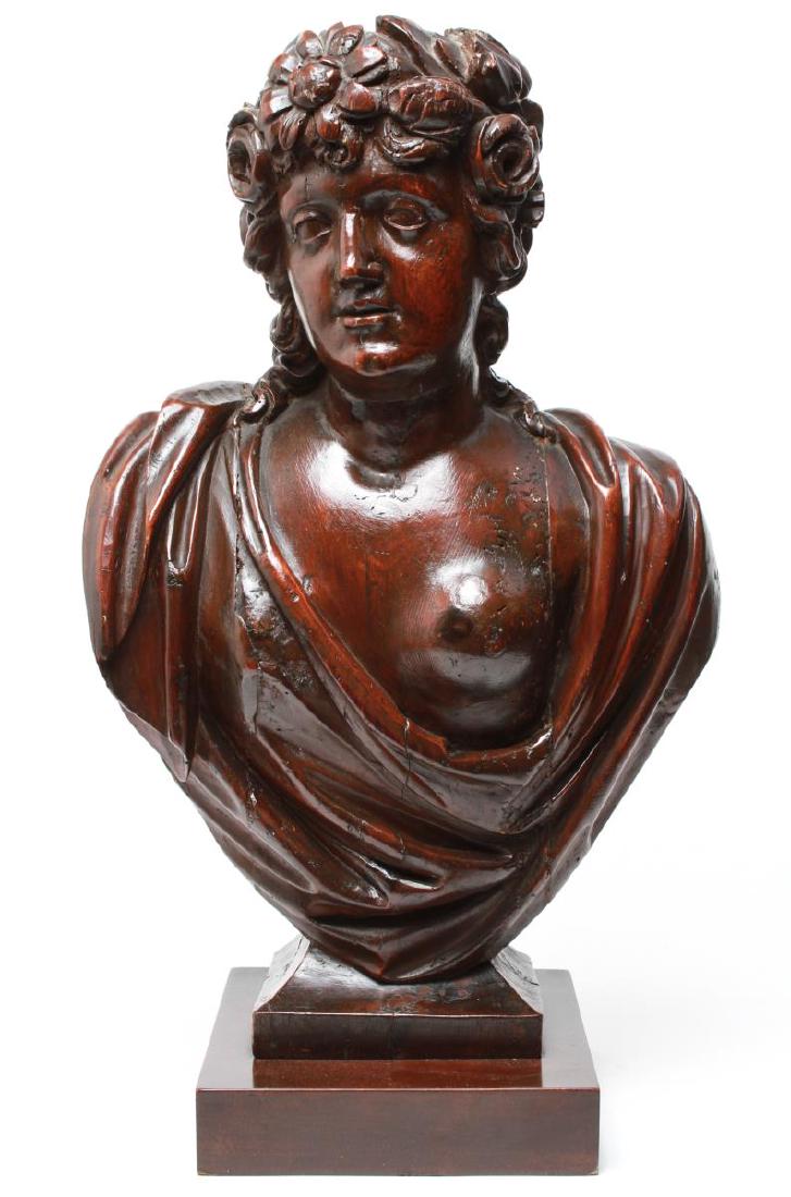 Italian Carved Wood Classical Bust Woman Antique: Italian antique carved wood Classical bust of a right-facing woman with a chaplet of flowers on her head and one breast exposed, probably early 19th century, now mounted on a contemporary wood base, o