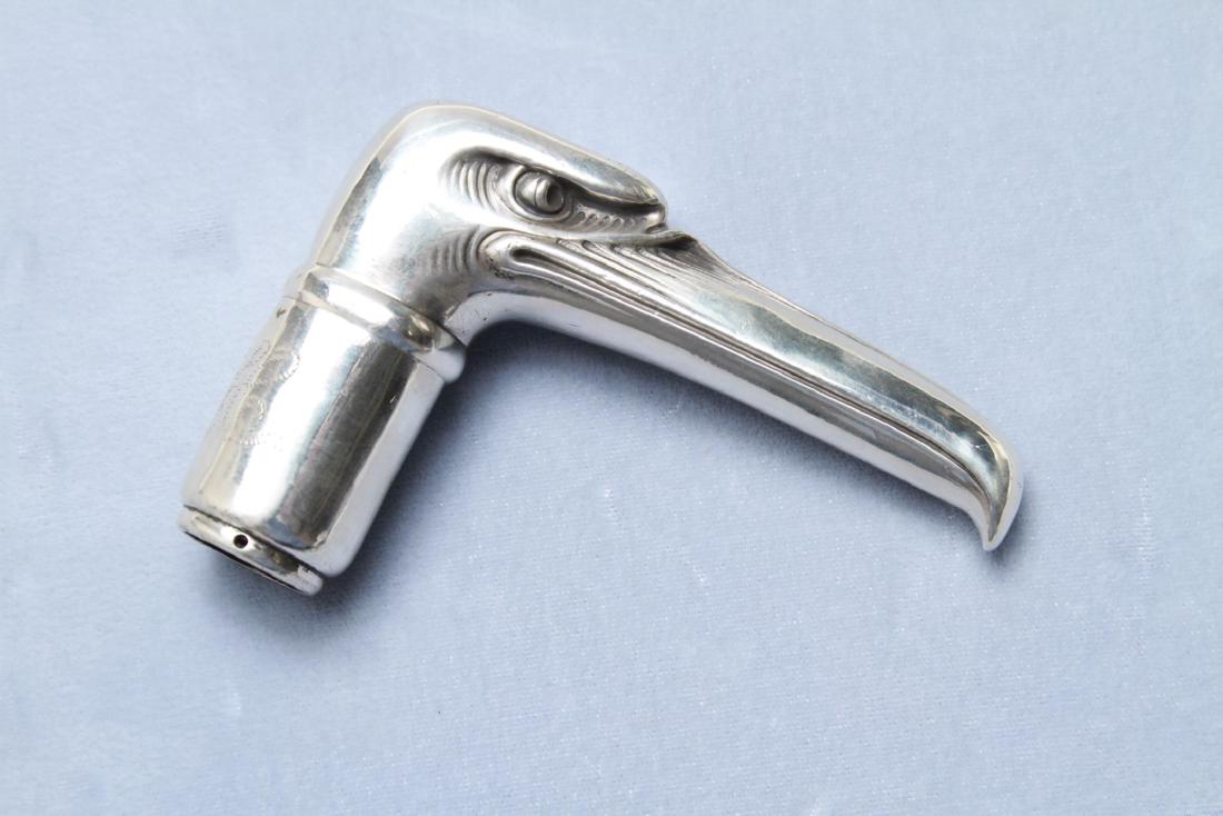 Tiffany Silver "Nast" Eagle Cane Handle c. 1910: Tiffany & Co. sterling silver "Nast" eagle cane handle, in the form of an eagle's head with elongated beak, after the Eagle cartoons by Thomas Nast, monogrammed, circa 1910, maker's mark. 2.75" H x 3.