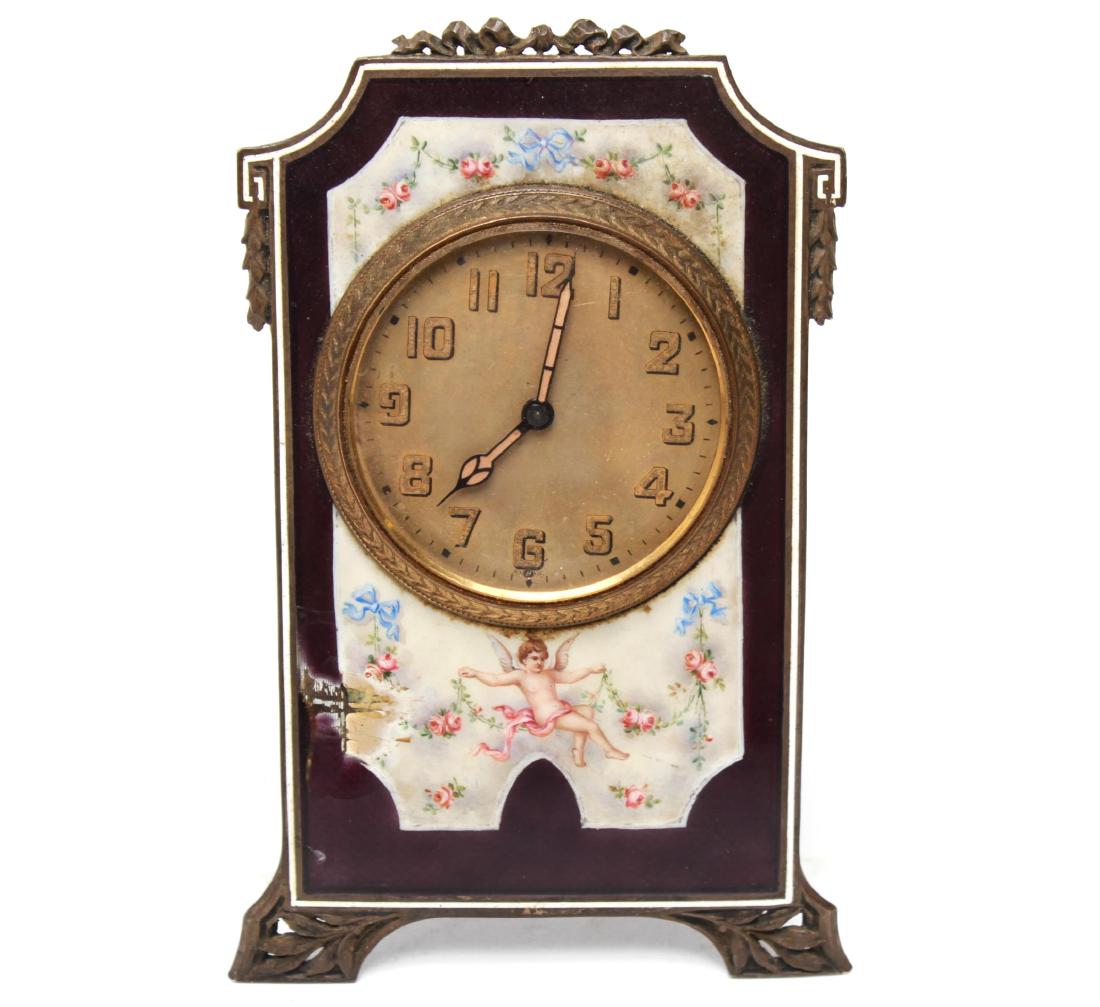 Continental Edwardian Enameled Bronze Ladies Clock: Continental, probably Austrian, Edwardian easel back bronze ladies clock enameled with a cherub and swags of blown roses and blue ribbons, the back stamped "2981" and "30389." 4.5" H. Losses to enamel