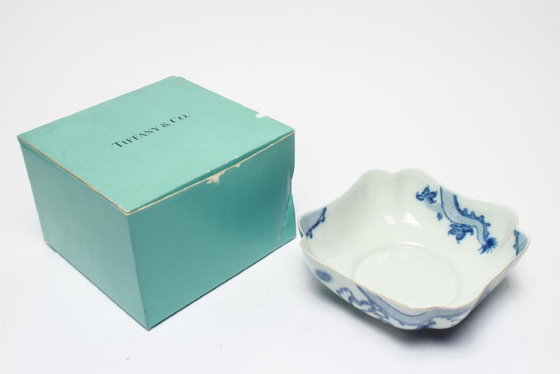 Tiffany & Co Mottahedeh Blue Dragon Porcelain Bowl: Tiffany & Co. / Mottahedeh "Blue Dragon" -pattern porcelain bowl, the square-sided serving piece with scalloped corners displaying underglaze-blue dragons, flaming pearls, and stylized clouds, the und