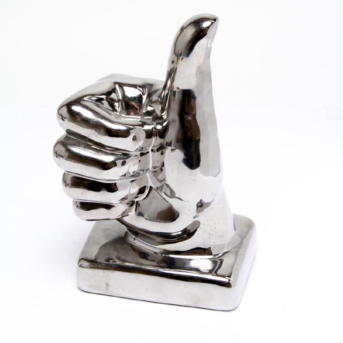 Cast Silvered Plaster "Thumbs Up" Sculpture: Cast silvered plaster "Thumbs Up" tabletop sculpture, illegibly stamped on the underside. 11" H. Some wear to silver on edge of one knuckle.