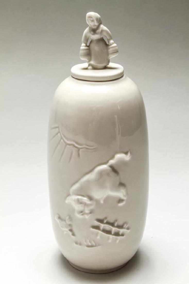 Royal Copenhagen Bode Willumsen Porcelain Jar: Bode Willumsen (1895-1987) for Royal Copenhagen blanc de chine porcelain covered jar #20498, "Bull's Trade," vintage 1950s, the body depicting two men bartering while a playful bull chases a chicken,