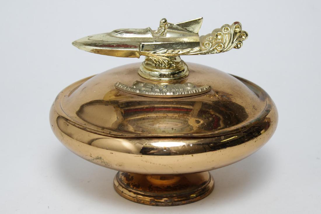 Texmo Hydroplane Speedboat Covered Metal Bowl: Texmo Industries coppered metal covered bowl, the lid with gold-tone metal handle in the shape of a speedboat and metal tag reading "Texmo / Outboard Unlimited Hydroplane, " the underside with the fac