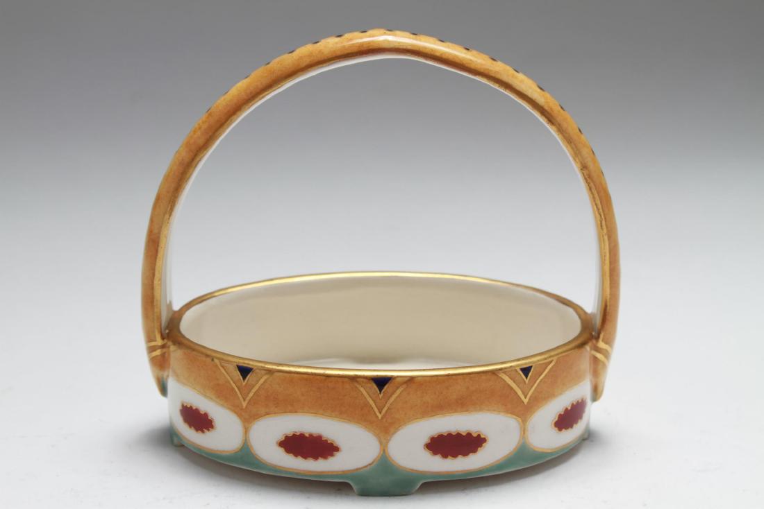 Serapis Wahliss Secessionist Ceramic Basket: Earthenware basket designed by Karl Klaus for the Serapis Wahliss line decorated in the Secessionist style with polychrome enamels, Vienna, Austria 1906; factory marks with serial numbers on the base.