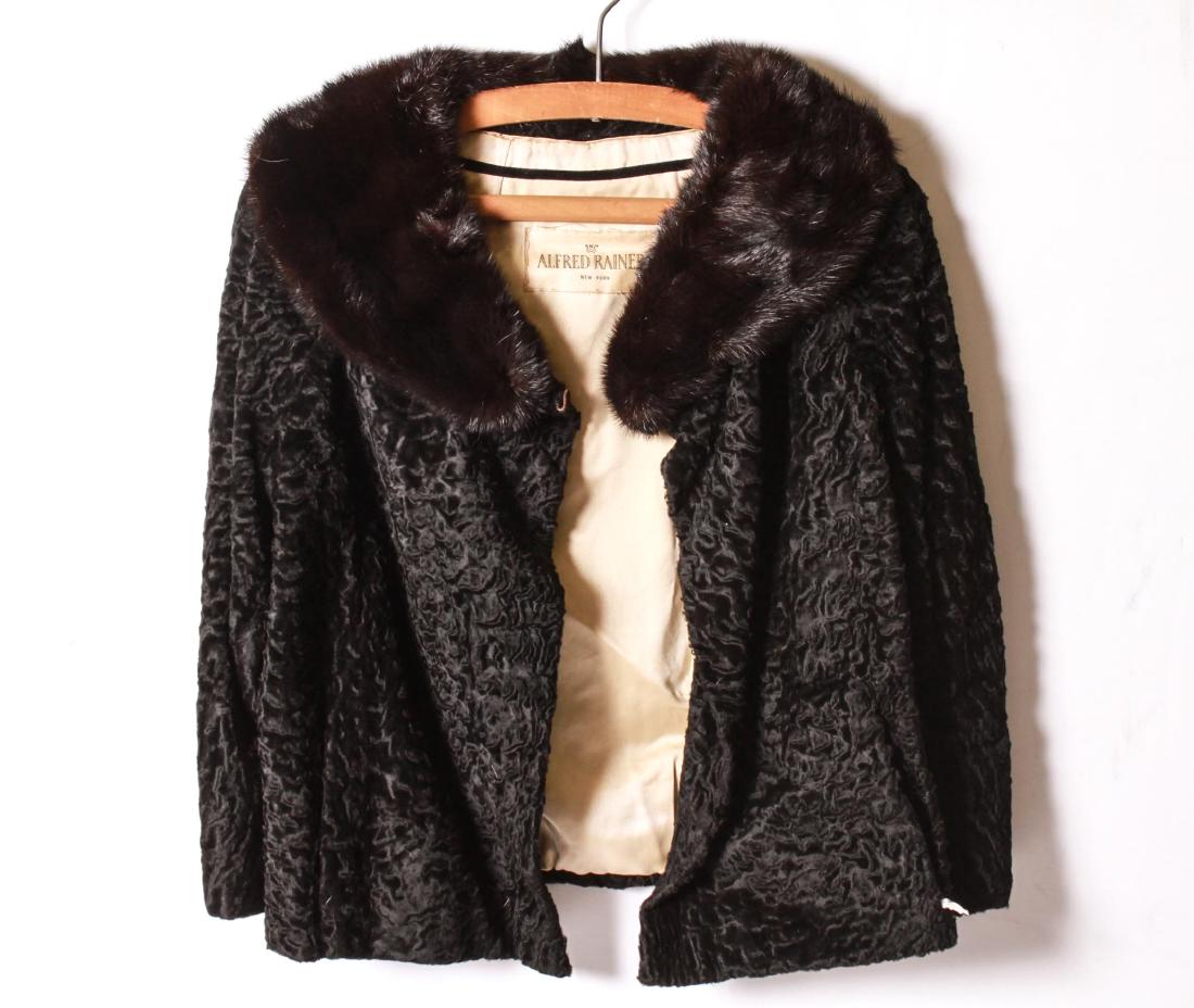Alfred Rainer Persian Lamb & Mink Fur Coat: Alfred Rainer Persian lamb fur coat with a mink collar, silk lining, tag marked "Alfred Rainer Inc, New York", monogrammed in interior. Shoulders: 17" L; sleeves:18" L, length: 23" L. Tears in shoulde