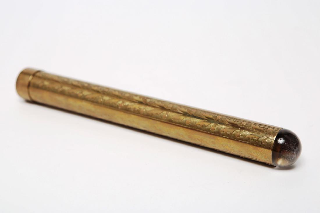 Kaleidoscope, Gilt Brass & Crystal, Vintage: Kaleidoscope with gilt brass tube stamped with a leaf-and-berry pattern, topped with a domed crystal, displaying grisaille patterns in white, grey, and black. 9.25" L.