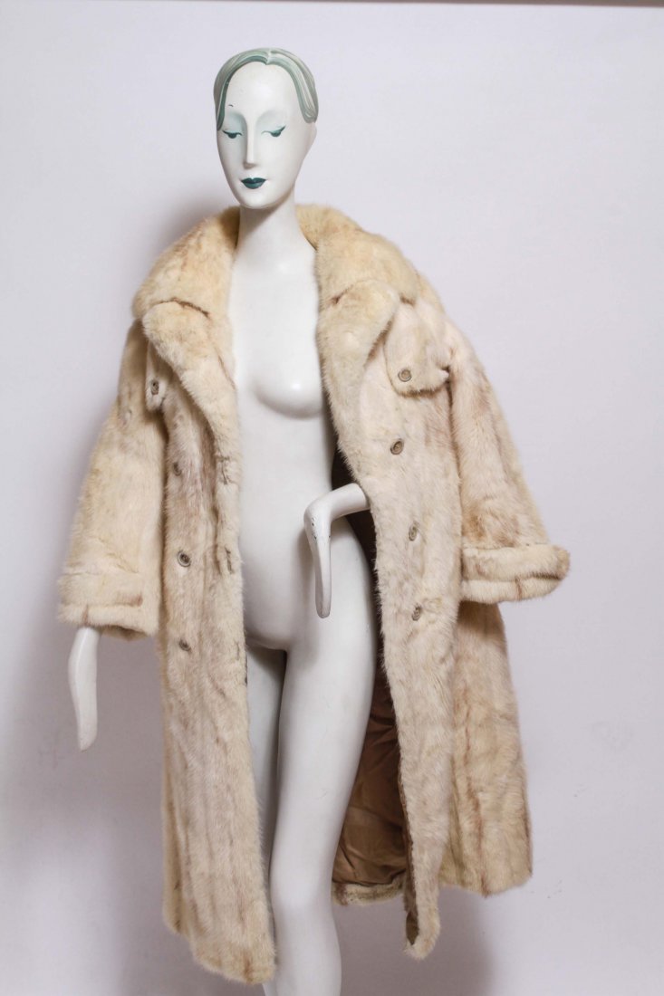 Vintage Balencia Mink Fur Trench Coat, White: Vintage mink coat by Balencia Furs, a double-breasted trench with epaulettes, gun flaps, and cuff-straps, in beige-weight with narrow light brown stripe through center of each skin. Sleeve: 21.5" L; s