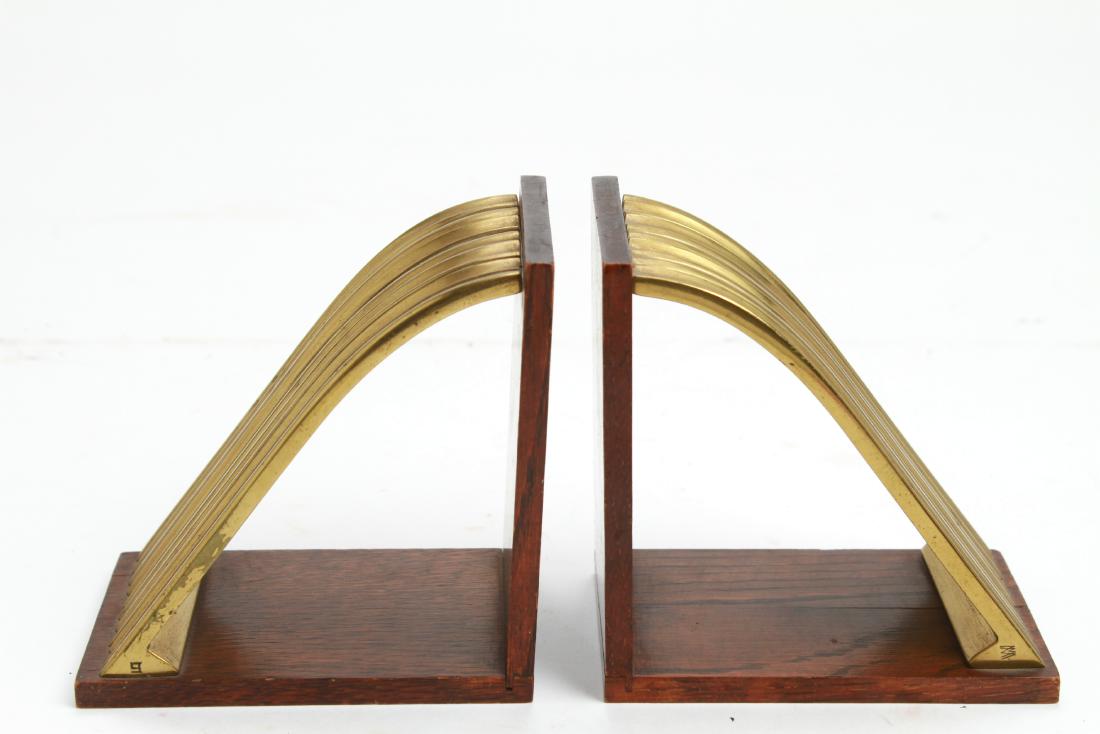 Joseph Hoffmann Wiener Werkstatte Bookends, Pair: Pair of Joseph Hoffmann Wiener Werkstatte bookends, brass and wood, Joseph Hoffmann maker's mark at corner, interlocking "WW" maker's mark at other corner. 3.75" H x 3.5" W. One missing screw and with