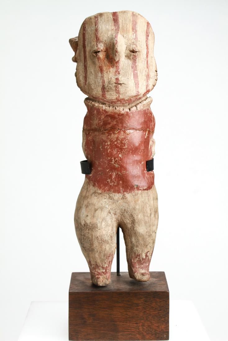 Pre-Columbian Terracotta Figure w Striped Face: Pre-Columbian terracotta standing figure, arms at sides with pigment decoration, vertical striped face, on wood base, possibly Nayarit or Jalisco, Mexico. Terracotta figure: 9.5" H; with base: 11.25" 
