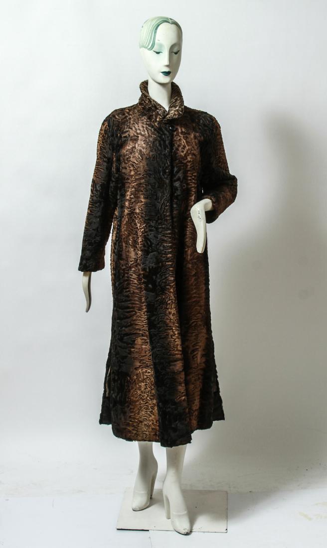 Ladies' Vintage Persian Lamb Fur Full Length Coat: Ladies' vintage Persian lamb fur coat, brown and black, full length, striped lining. Shoulders: 17" W; sleeves: 22" L; length: 51" L. From the Estate of fashion executive Margot Rogoff.