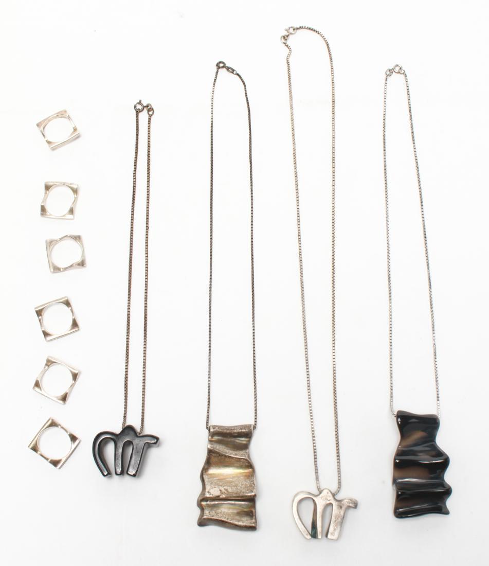 Brusca Dante Modernist Rings & Necklaces, 10 Pcs.: Brusca Dante Modernist rings and necklaces, 10 total, six stacking silver square chevron shape rings, four necklaces with sterling silver chains, two with black glass pendants, in shape of "M" and abs