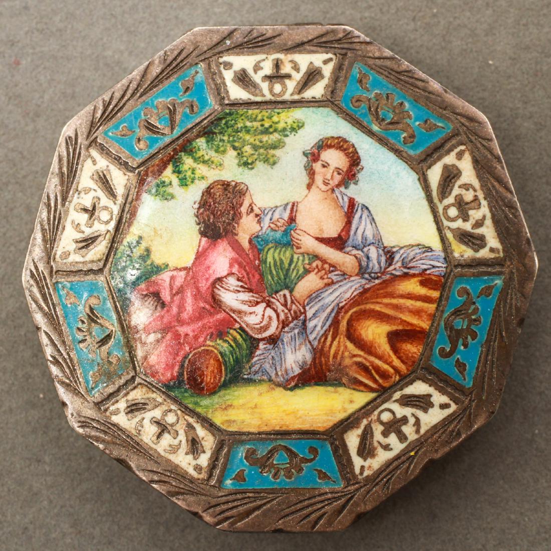 Austrian Continental Silver and Enamel Compact: Austrian Continental silver compact with enamel figural scene decoration depicting two courting lovers, decagonal form, interior marked '800.' 2" diameter. Not weighable. From the Estate of fashion ex