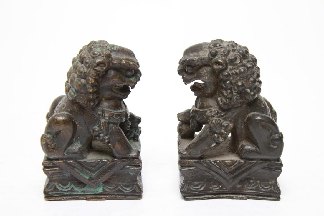 Chinese Bronze Foo Dogs / Lions, Pair: Pair of Chinese bronze foo dogs / lions, male and female, plinth bases. 3.75" H.