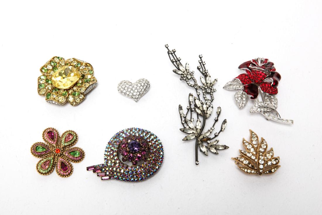 Kenneth Lane, Nolan Miller, Poggi & Other Brooches: Group of costume jewelry rhinestone brooches, six total, including pieces by Kenneth Lane, Nolan Miller, Poggi Paris and others. Largest: 4.5" L x 1.5" W.