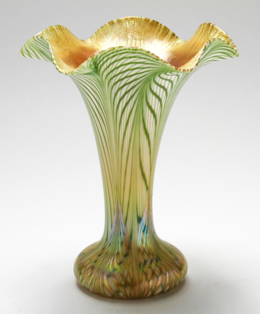 Quezel Iridescent Art Glass Ruffled Trumpet Vase: Quezel gold and pulled green feather iridescent art glass ruffled trumpet vase, etched signed: "Quezel / M / 905," with original foil label: " A. Stowell & Co. / 24 Winter St. Boston." 7.75" H x 6.25"