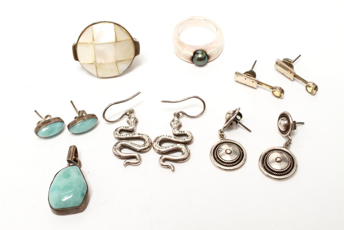 Silver Jewelry Rings Earrings Pendant Group of 7: Sterling silver jewelry group of seven, comprising snake earrings with diamonds, marked: "14K / 925 / Robert Lee Morris for Elizabeth & James," modern silver ring with a Tahitian pearl, a mother of pe