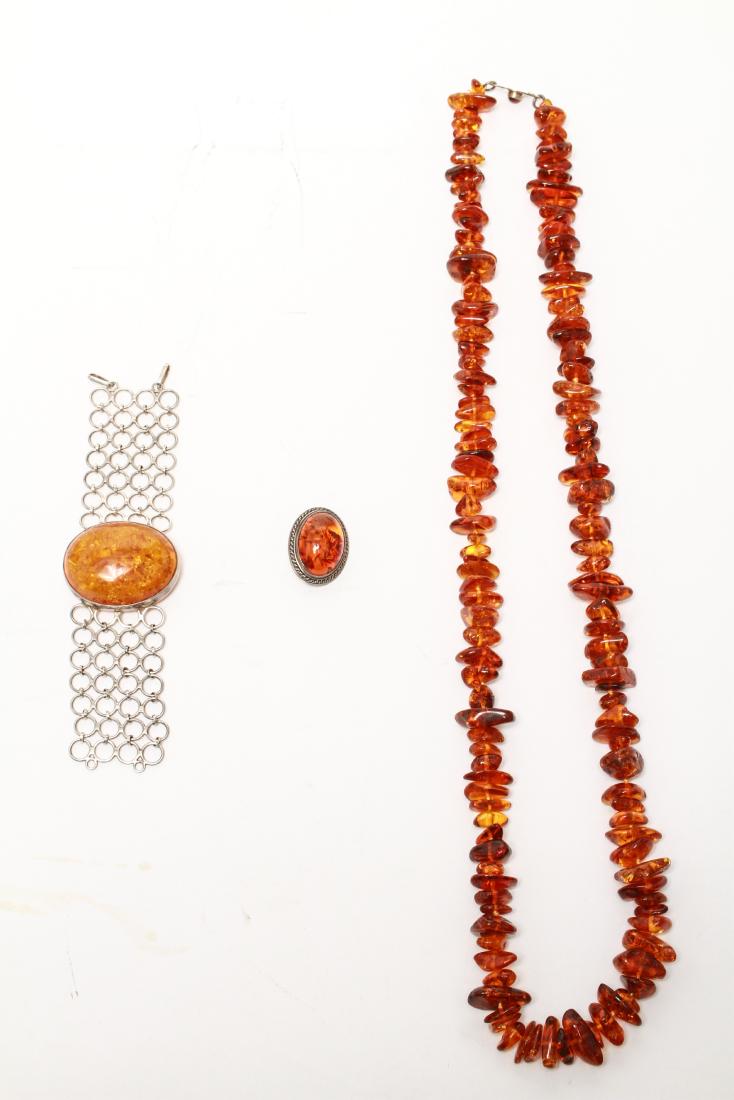 Silver & Baltic Amber Brooch Bracelet & Necklace 3: Group of three, sterling silver Baltic amber brooch, bracelet, marked: "925," and necklace, marked "Nepal" Brooch: 1.375" L. Bracelet: 7" L; necklace: 18" L. Silver tested; not weighable.