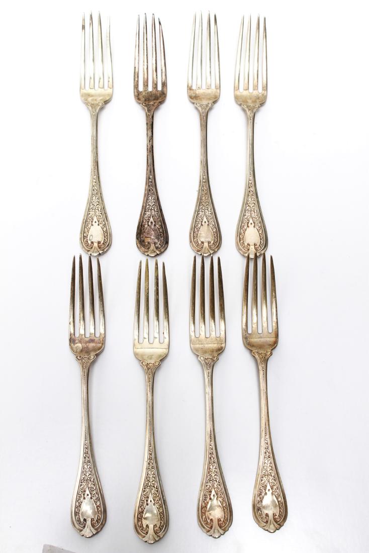 Sterling Silver Dessert Forks, Set of 8: Sterling silver set of eight dessert forks, shield and scroll motif, marked, "Sterling." 6.25" L. Approx 7.19 ozt. From the Estate of Peter Knoll.