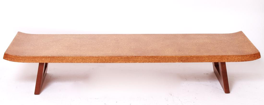 Paul Frankl Mid-Century Modern Cork Coffee Table: Paul Frankl mid-century modern coffee table with lacquered cork top, mahogany base, manufactured by Johnson Furniture Co., stenciled numbers underside. 13" H x 70" L x 21" D. From the Collection of Ac