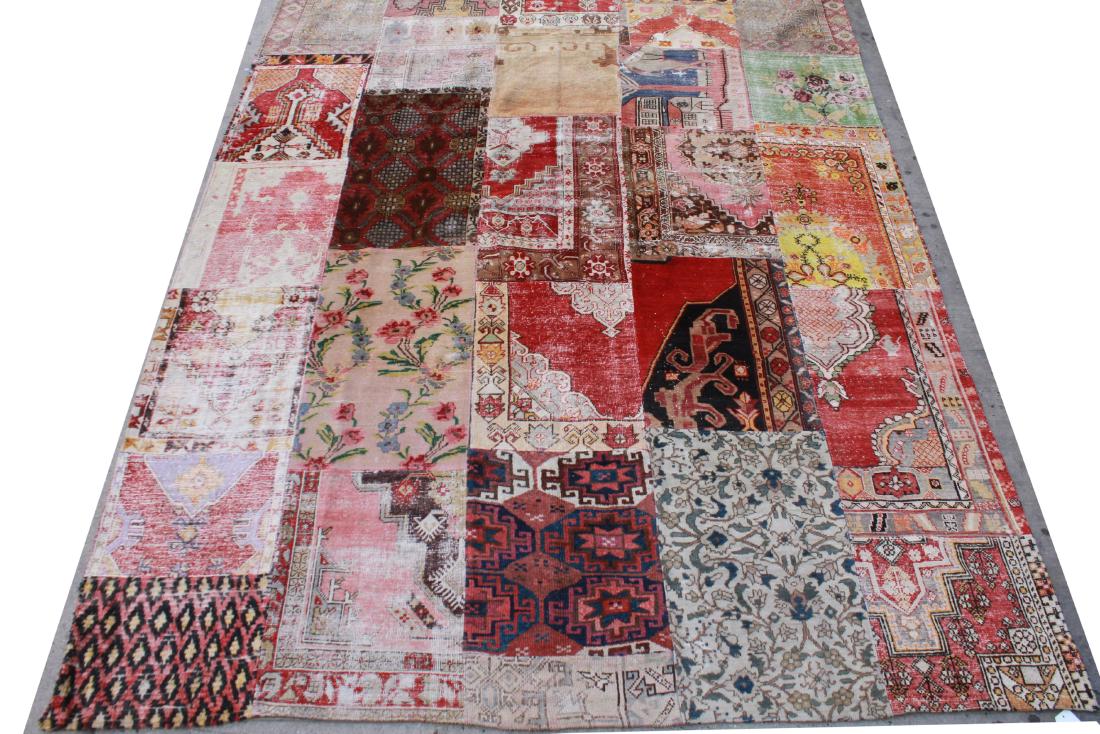 Patchwork Boho Carpet 9' 9" x 13' 1": Boho carpet featuring colorful patchwork of various rug designs. 9' 9" x 13' 1" Light soiling. From the Collection of Actor Ron Rifkin.