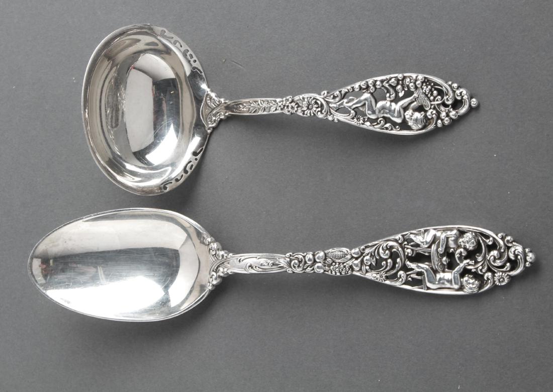 D&H Silver "Labors of Cupid" Serving Utensils, 2: Reed & Barton / Dominick & Haff sterling silver "Labors of Cupid" pattern, two serving utensils, comprising a serving spoon and ladle, maker's mark: Dominick & Haff and marked: "Sterling." Longest 8.5