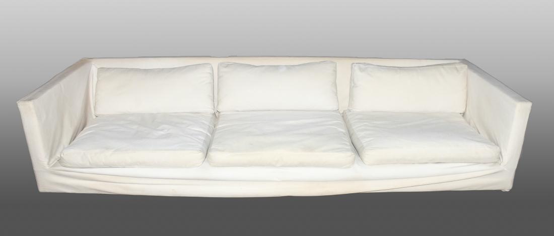 Harvey Probber Mid-Century Modern Tuxedo Sofa: Harvey Probber Mid-Century Modern Tuxedo Sofa, model #1257, 1960s, three-seat, white upholstery, peg legs. 25" H x 102.5" W x 33.5" D. Stains throughout.