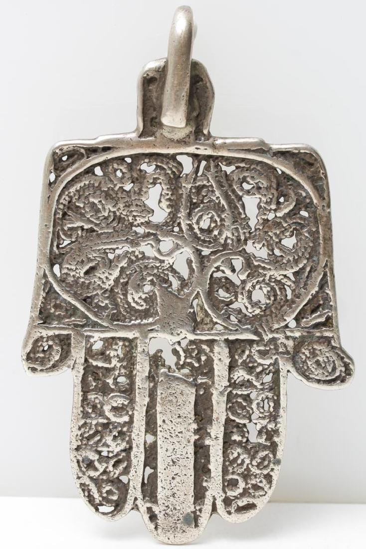 Middle Eastern Silver Hamsa/Hand of Fatima Pendant: Silver ethnographic pendant, in the form of the Hamsa, or Hand of Fatima; Middle Eastern Islamic or Judaica jewelry, possibly Yemenite. 3" L. Silver tested; approx. 0.8 ozt.
