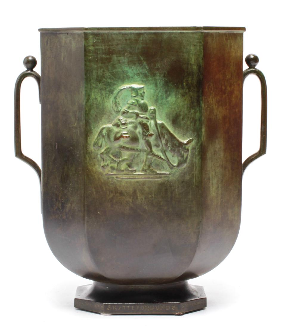 Jacob Angman for GAB Sweden Bronze Vase: Jacob Ängman for GAB Sweden bronze vase, relief of man riding horse, likely Don Quixote, on either side, open handles and footed base, maker's mark underside, inscribed on foot "Krst. Lans Skytteforb