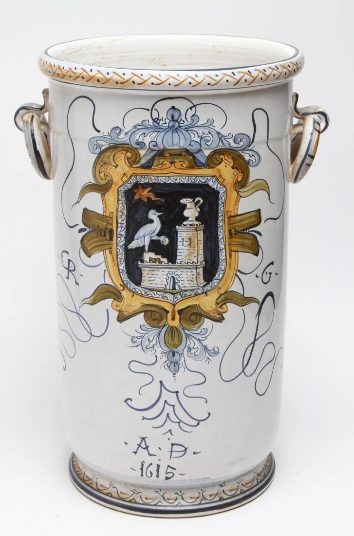 Italian Faience Umbrella Stand w Armorial Motif: Italian faience umbrella stand, armorial motif featuring shield with bird perched on castle, applied ring handles at sides, inscribed underside "For Vietri Made in Italy..." 19.25" H x 11.25" diameter