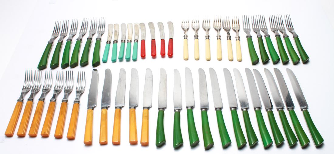 Bakelite Handled & Stainless Assorted Flatware, 50: Group of 50 Bakelite handled and stainless steel assorted flatware, comprising 12 green handled dinner knives and 12 matching forks, 5 butterscotch handled knives and 6 matching forks, 6 cream handled