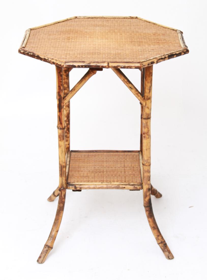 Aesthetic Mvt Octagonal Bamboo & Rattan Side Table: Aesthetic Movement / Asian manner octagonal side table / stand, with bamboo frame, rattan covered top and stretcher shelf. 29.25" H x 21.75" W. From the Collection of Actor Ron Rifkin.