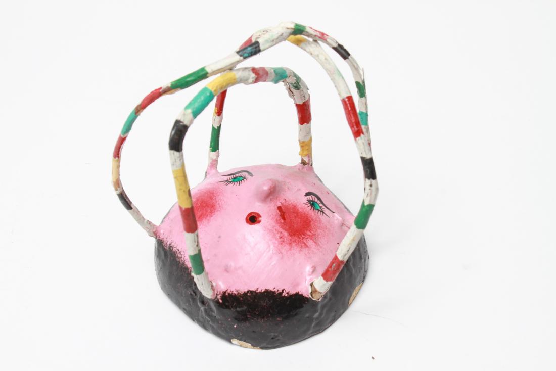 Folk Art "Face" Hand-Painted Coconut Sculpture: Folk Art "Face" hand-painted coconut, table top mixed-media sculpture. 7.5" H x 6" diameter. Minor paint loss at edge. From the Collection of Actor Ron Rifkin.