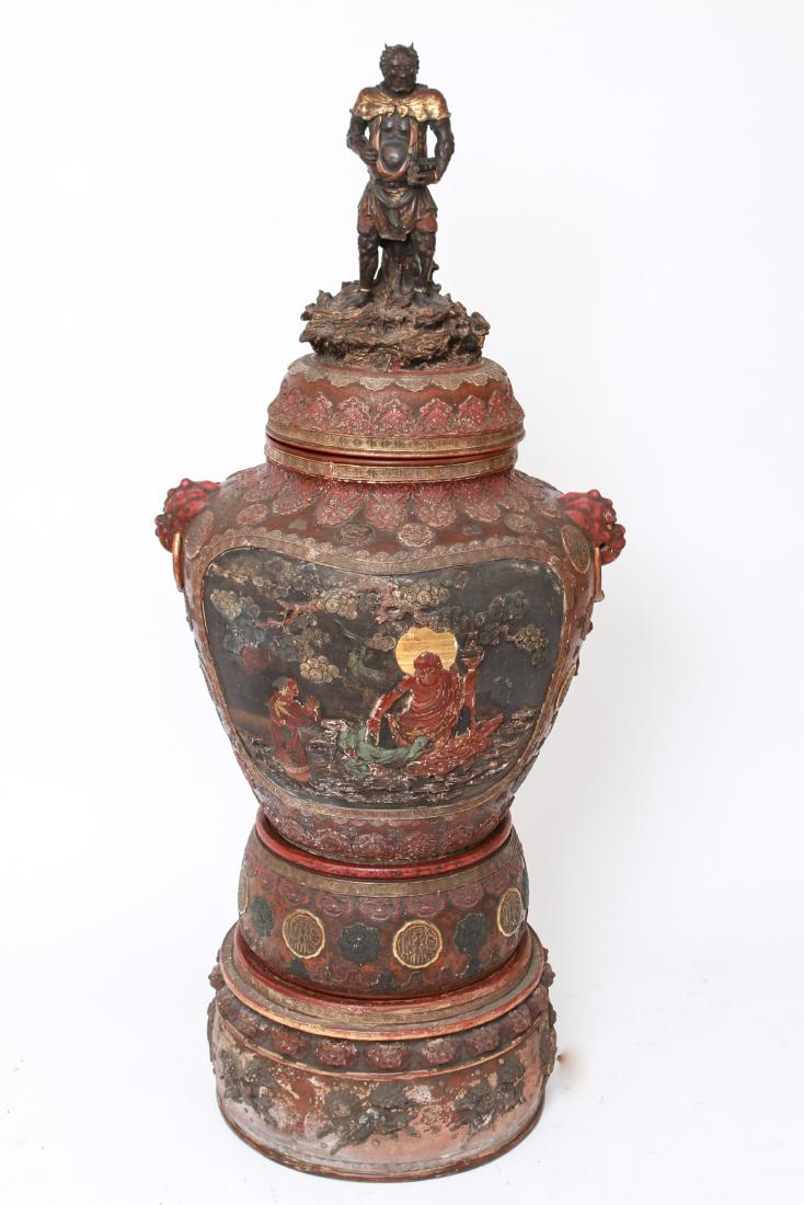 Japanese Meiji Period Polychrome Monumental Temple Urn: Japanese Meiji Period monumental polychrome earthenware / terracotta temple urn / vase with sculpted lid bearing an Oni / demon figure holding scrolls, gilt details, large medallions on the front and 