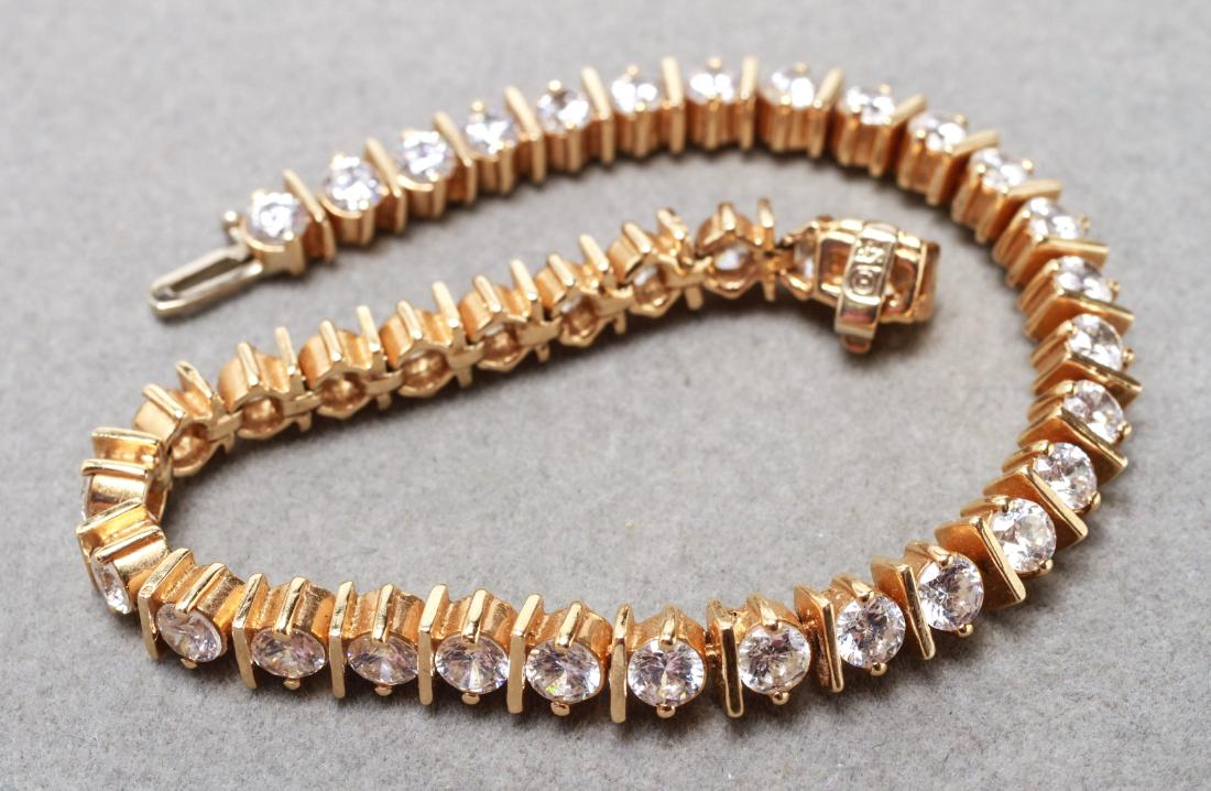 14K Yellow Gold & Cubic Zirconia Tennis Bracelet: 14K yellow gold and cubic zirconias tennis bracelet, marked: "14K." 7" L. Approx 13.4 dwt inclusive.
