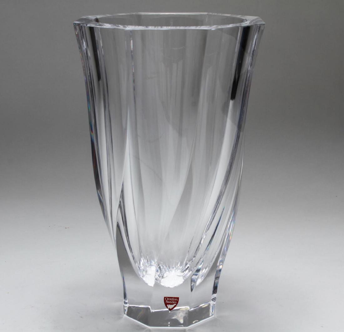 Orrefors Sweden Lead Crystal "Residence" Vase: Orrefors Sweden colorless lead crystal "Residence" pattern vase, "Orrefors Sweden" label, underside acid-etched "Orrefors OA 4570-25." 9.75" H x 5.75" diameter.