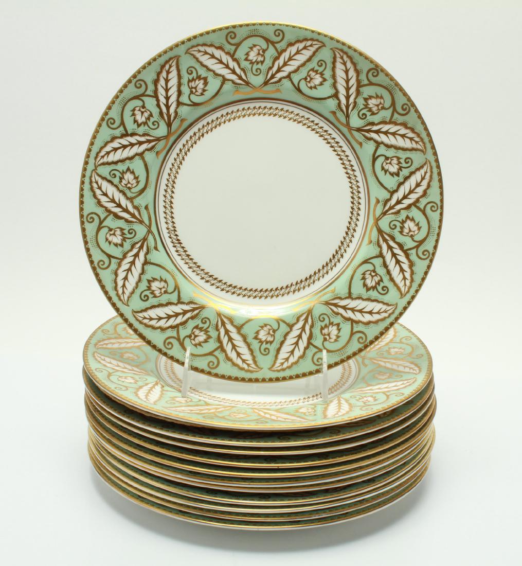 Royal Worcester "Ettrick" Porcelain Plates, 12: Royal Worcester "Ettrick" porcelain dinner plates, green and gilt foliate motif decoration, maker's mark underside including "Royal Worcester Made in England Ettrick." 10.5" diameter. From the Estate 