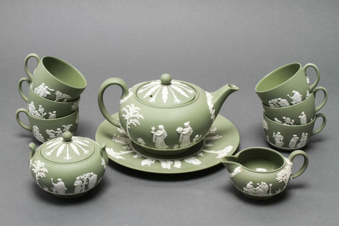 Wedgewood Jasperware Tea Set Service, 10: Wedgewood Jasperware tea set service in green and white, 10 pieces, 6 teacups, 1 sugar bowl, 1 creamer pitcher, 1 teapot, 1 tray, all marked "Wedgewood, Made in England." Tallest: 4.75" H x 9" W x 6"