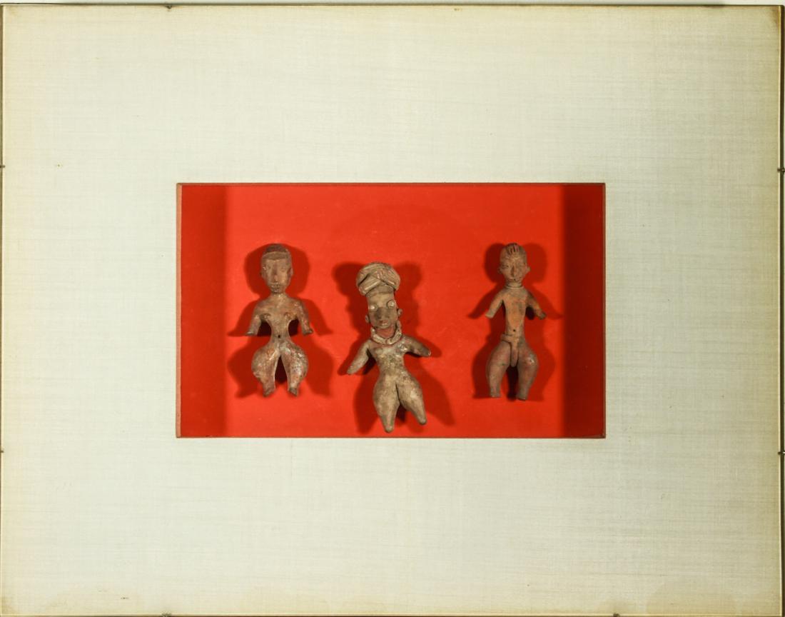 Pre-Columbian 3-Small Figures Pottery Earthenware: Pre-Columbian three small pottery figures with traces of pigment, mounted and framed. Tallest: 4" H; frame: 14" H x 18" W x 1.5" D. From the Estate of Actor Miriam Colón.
