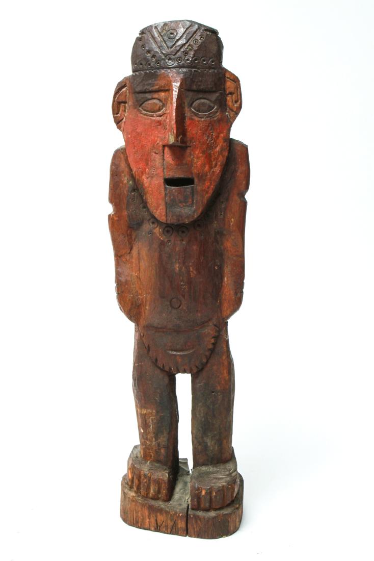 Pre-Columbian Chancay Peru Wood Shaman Figure: Pre-Columbian Chancay, Central Coast Peru, carved wood figure of a standing shaman, partial label on reverse. 18.5" H x 5" W x 4" D. Splits in wood. From the Estate of Actor Miriam Colón.
