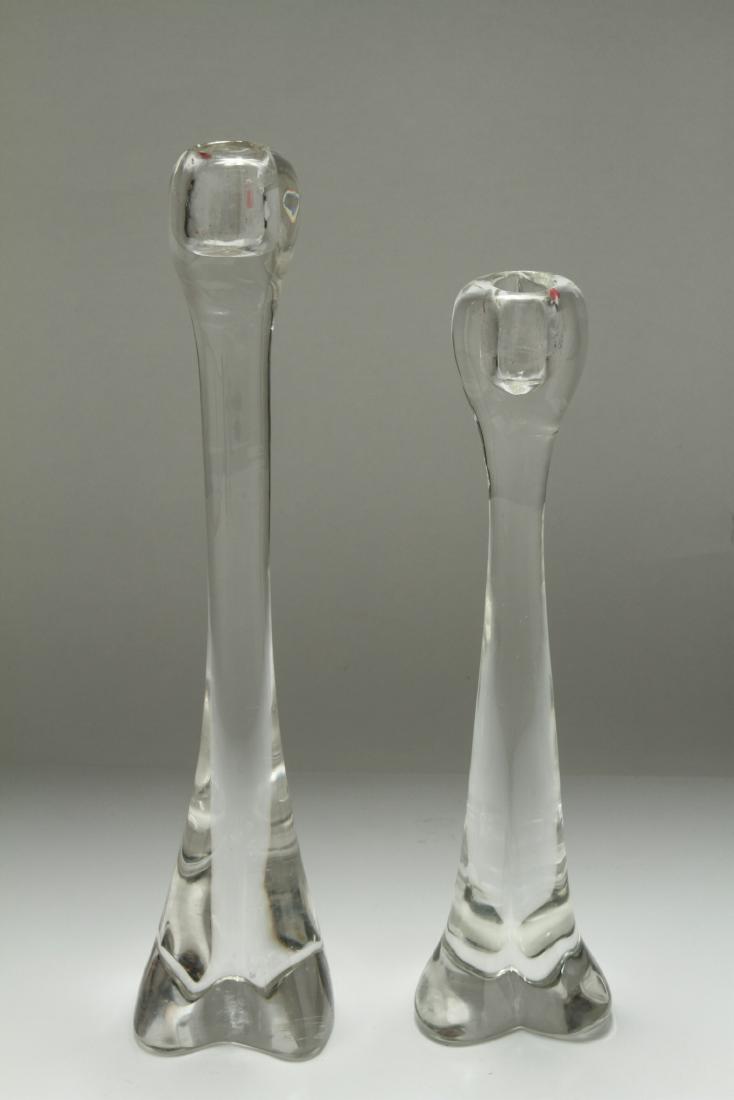 Elsa Peretti for Tiffany Crystal Candlesticks, 2: Elsa Peretti for Tiffany crystal candlesticks, two, taller marked underside "Elsa Peretti for Tiffany." Tallest: 13.5" H. Tallest with minor rim fleabites on rim, smaller with hairline.