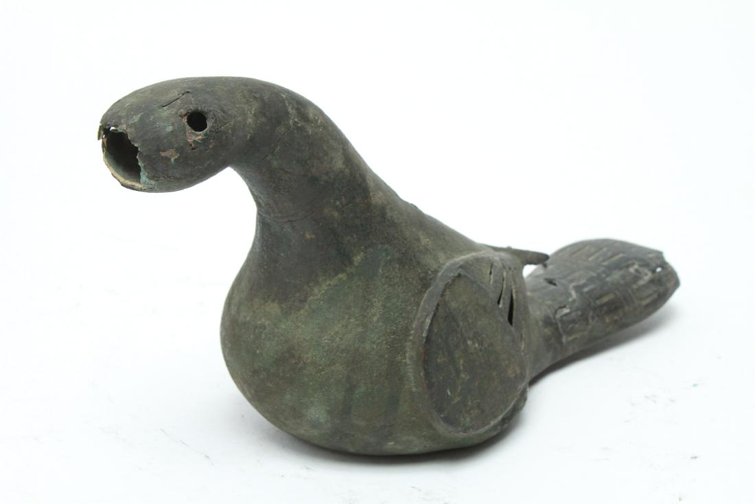 Antique Possibly Persian Bird Sculpture Copper: Antique possibly Persian bird sculpture copper with heavy verdigris. 4.75" H x 9.5" W x 4" D. Losses to beak and back of neck, repairs to top of tail. From the Estate of Actor Miriam Colón.