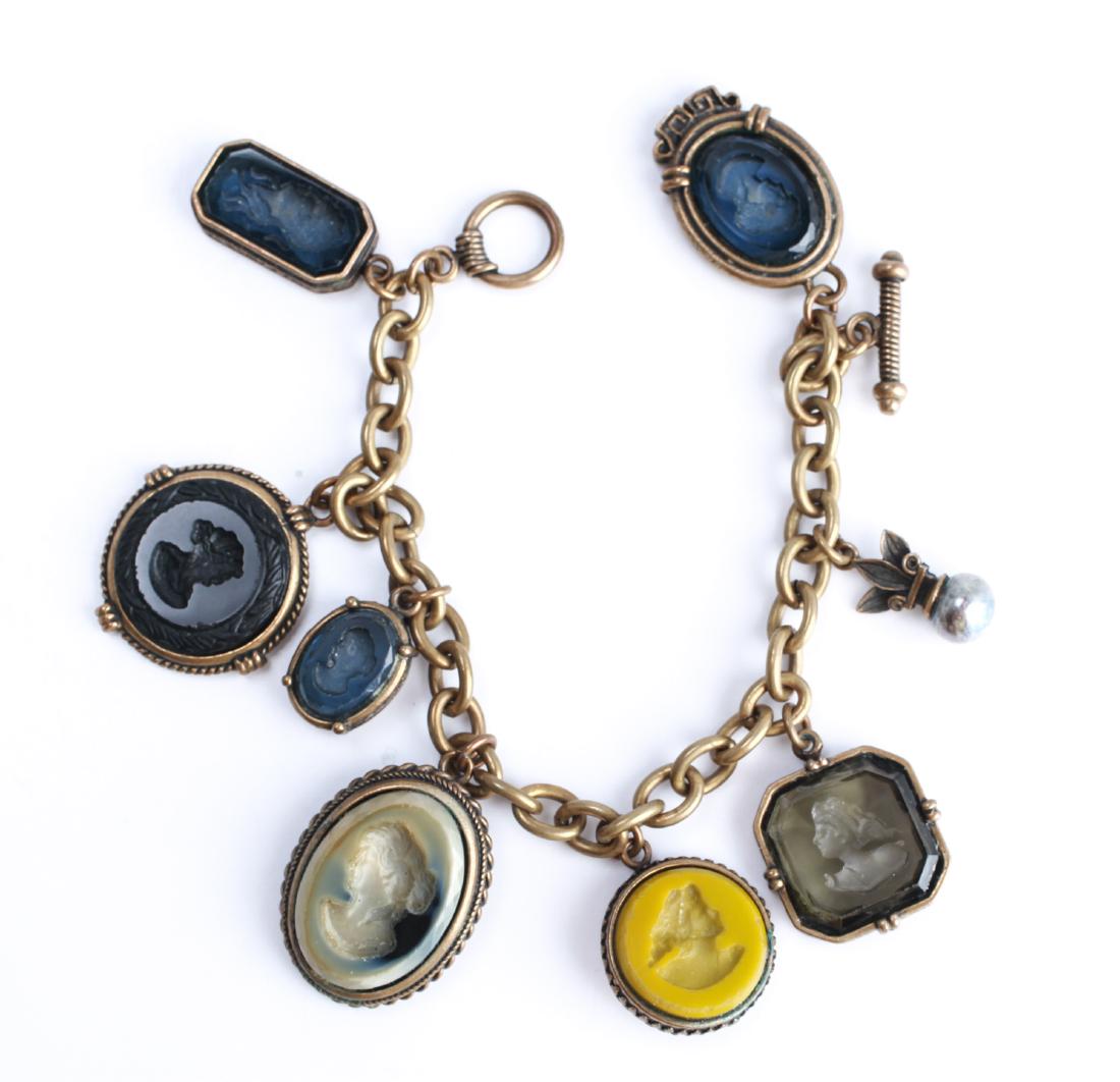 Extasia Intaglio Cameos & Gold-Tone Charm Bracelet: Extasia seven intaglio cameos and one gray pearl charms mounted in gold-tone metal, charm bracelet, marked: 'Extasia," cameos are hand carved by artisans in an Italian seaside village, Torre del Greco