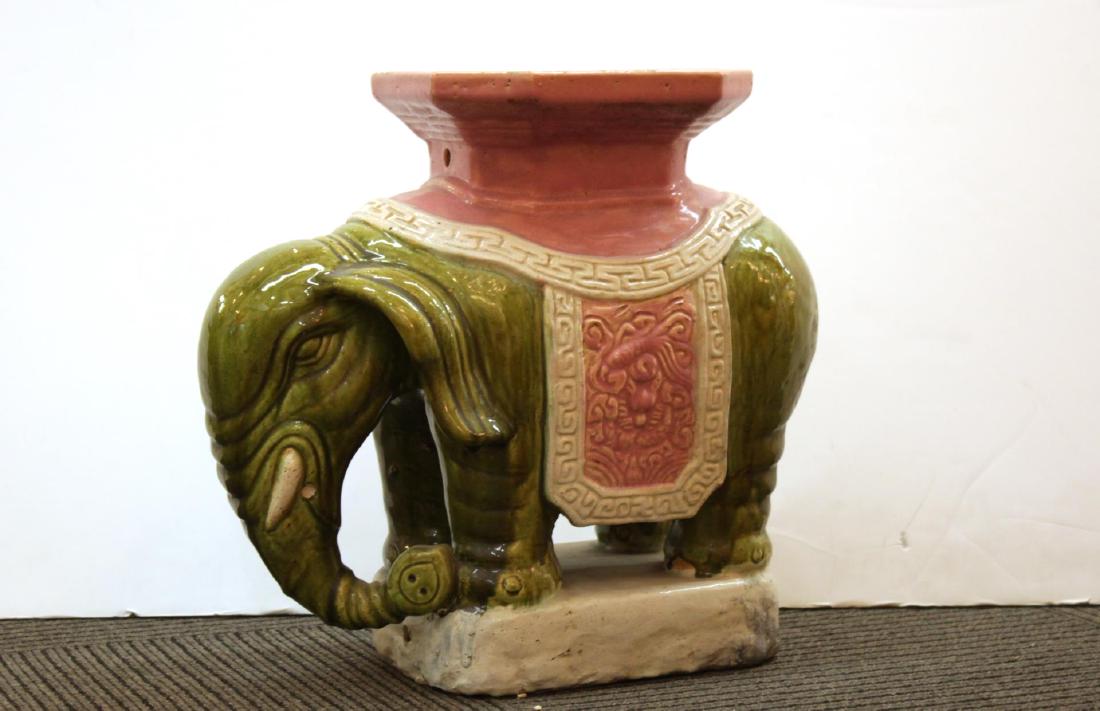 Vintage Ceramic Elephant Garden Seat or Stool: Vintage ceramic elephant garden seat or stool, green, white and pink glaze over incised geometric and floral decoration. 15" H x 18" W x 7" D.