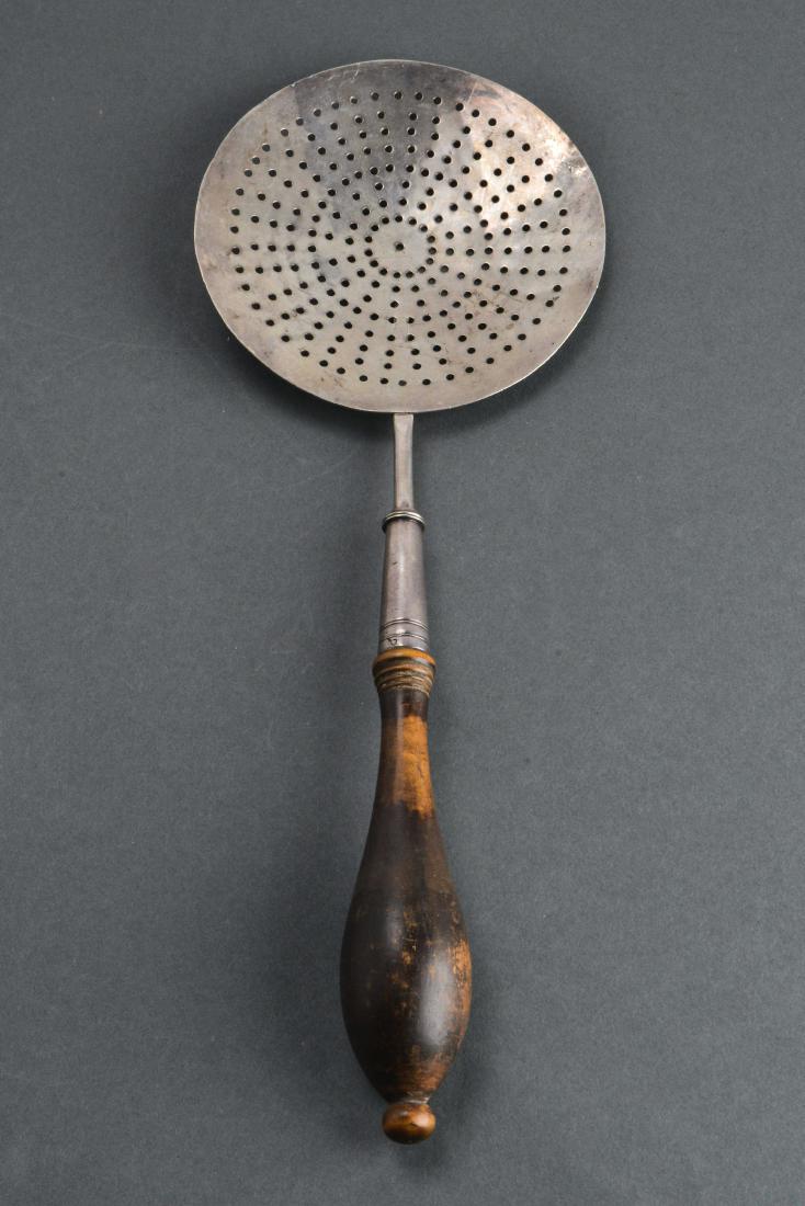 J. Mood Coin Pierced Silver Skimmer Utensil: J. Mood coin pierced silver skimmer utensil with wood handle, marked: "J. Mood," probably American. 12" L. Approx 3.60 ozt inclusive of wooden handle.