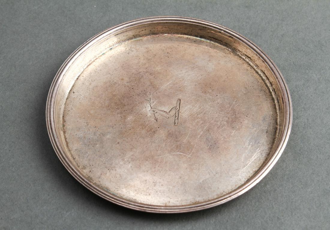 William Bond Irish Silver Wine Funnel Stand 1802: William Bond Irish sterling silver round wine funnel stand / coaster, engraved arm with hand holding arrow, hallmarked underside "WB / Dublin / Ireland / 1802." 3.25" diameter. Approx 1.33 ozt.