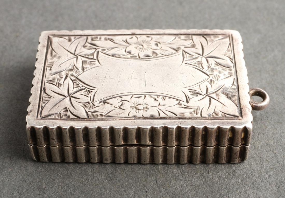 English Silver Vinaigrette Foliate Engraved 19th C: English sterling silver vinaigrette, case engraved with floral and foliate motifs, an interior hinged engraved gilt-silver pierced grille, gold-wash interior, hallmarked: "CS FS / Birmingham / England