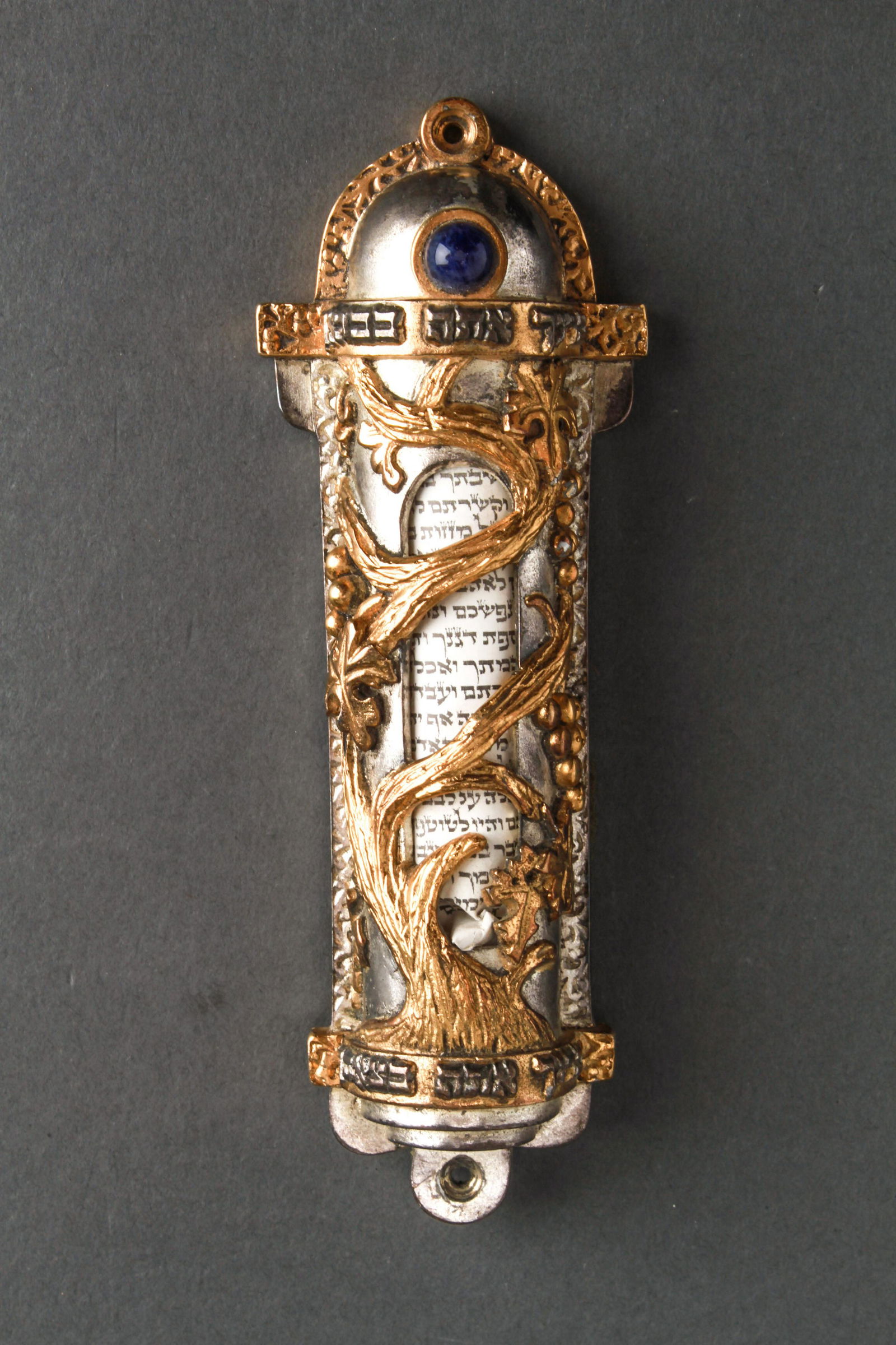 Judaica Mezuzah, Two-Tone Metal: Judaica Mezuzah, two tone metal with a cabochon blue hardstone. 5.25" H.