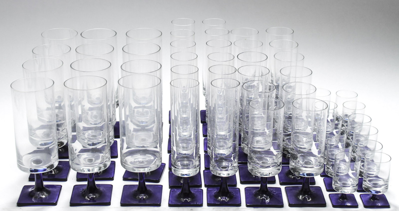 Rosenthal Linear Terzo Blue Stem Glassware Set, 48: Rosenthal "Linear Terzo Blue Stem" pattern glassware set, 48 total, water goblets, wine glasses, champagne flutes and sherry / cordial glasses, 12 each, undersides marked "Rosenthal." Largest: 7" H x 