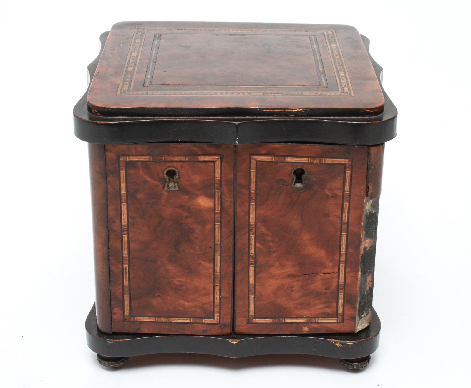 Continental Burlwood & Inlay Nécessaire, 19th C.: 19th century Continental burlwood and inlay nécessaire, the shaped two-door case with ebonized trim opening to reveal a velvet interior fitted with four glass toiletry bottles with foliate enamel lid